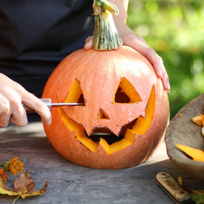 Carving a pumpkin for halloween