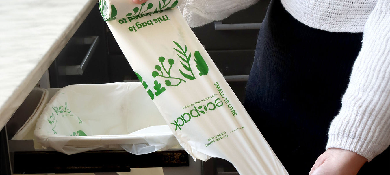 Ecopack bin liners on kitchen bench and in bin