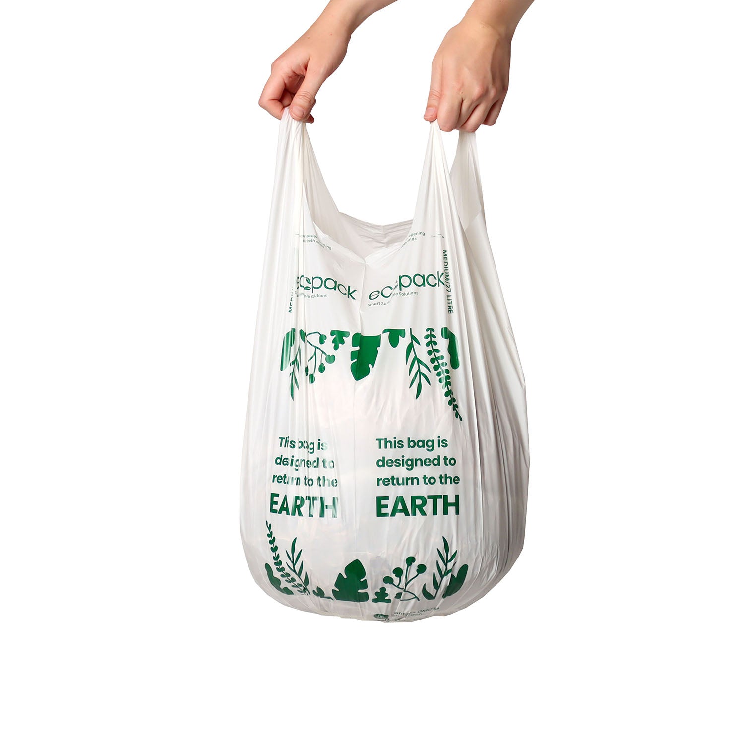 Hand holding a 27L compostable bin liner to show size