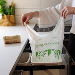 Small compostable bin liner in a kitchen bin with tie handles