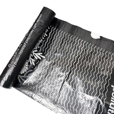 Ecopack 70L black drawstring recycled plastic garbage bag rolled out