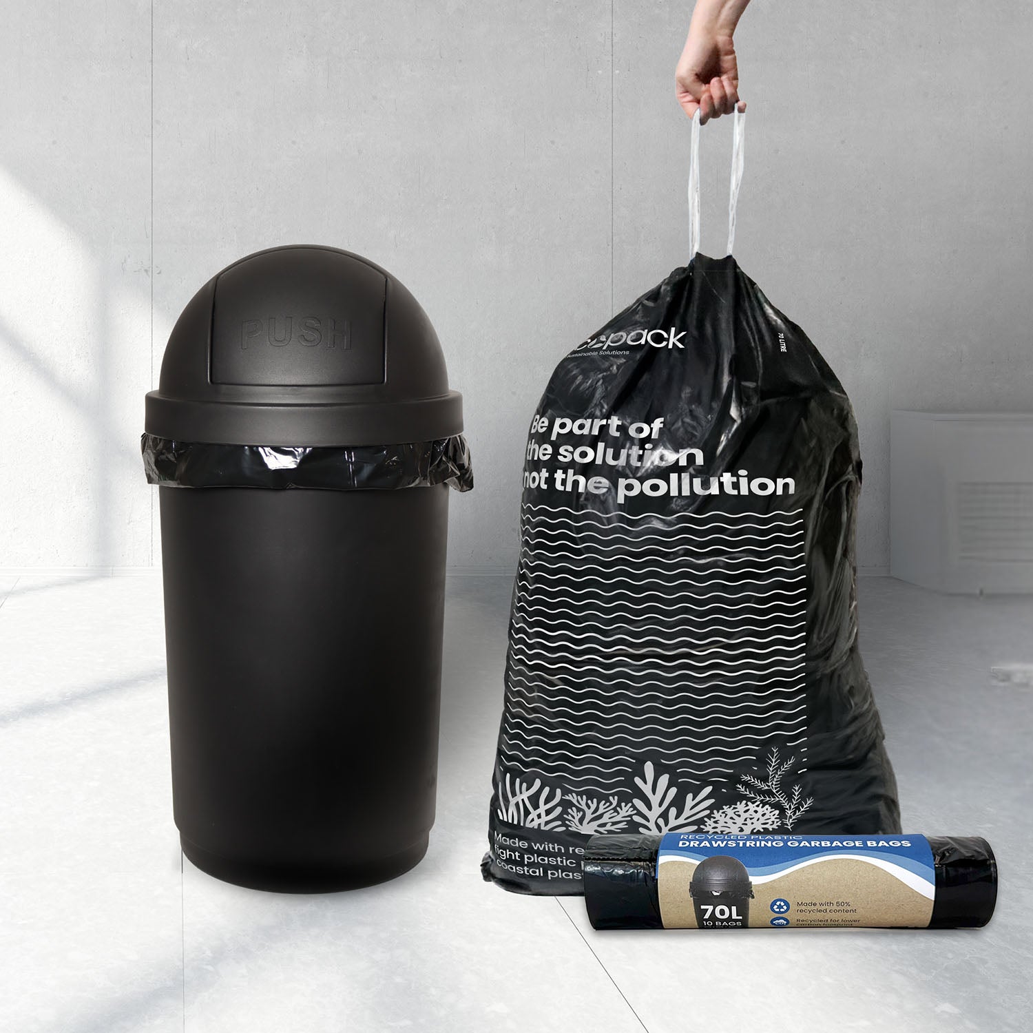 Ecopack 70L black drawstring recycled plastic garbage bag in use