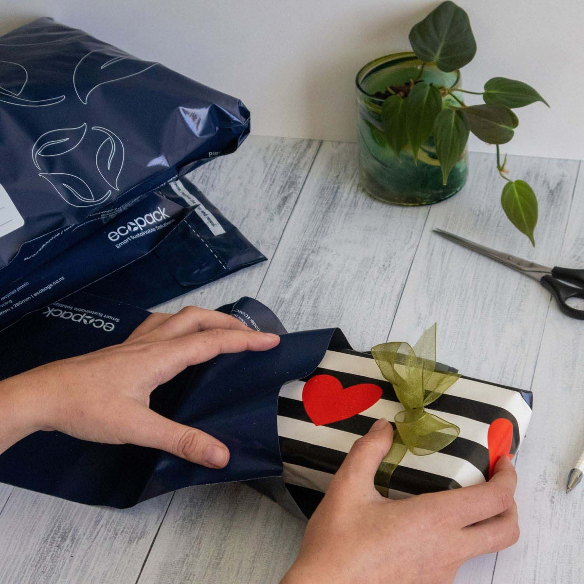Ecopack DLE recycled mailing satchel in use